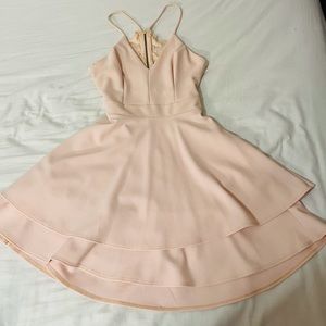 Short pink dress with embroidered backless